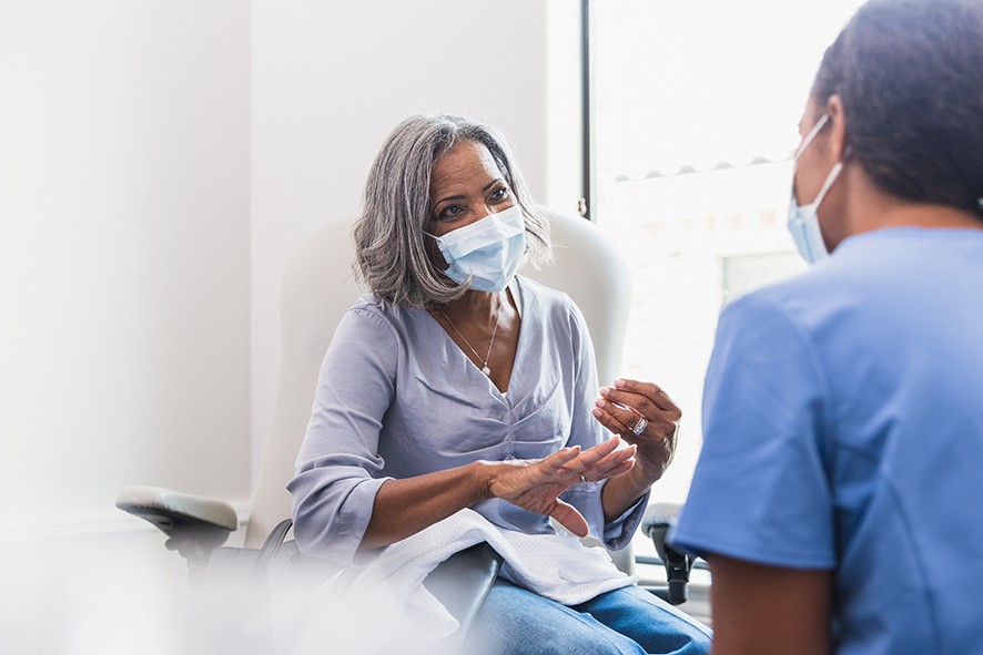 Woman in discussion with health professional during a consultation