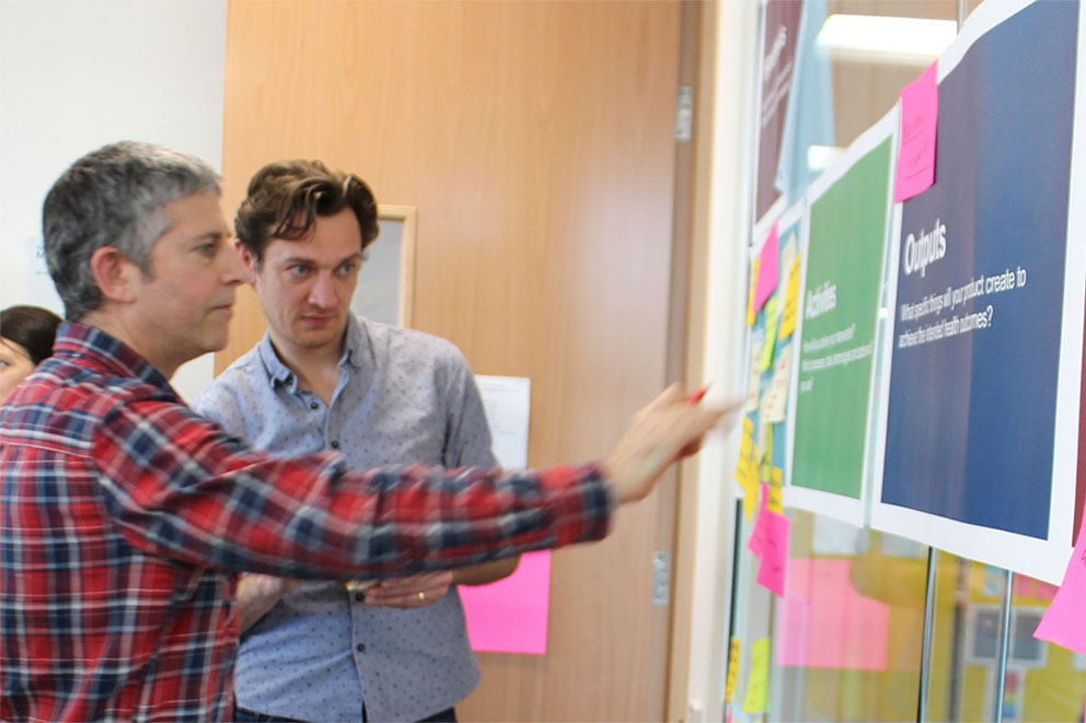 NHS website project team staff participate in a logic model workshop