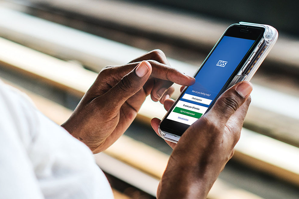 Woman using NHS App
