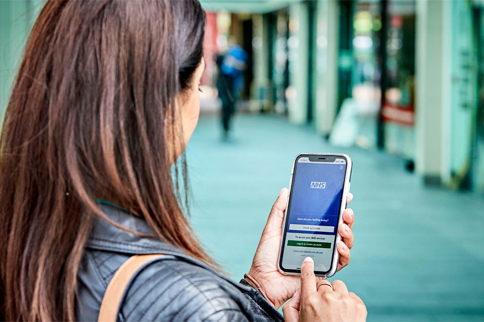 Person using the NHS App on a mobile phone