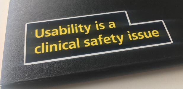 Image of folder with 'usability is a clinical issue' sticker