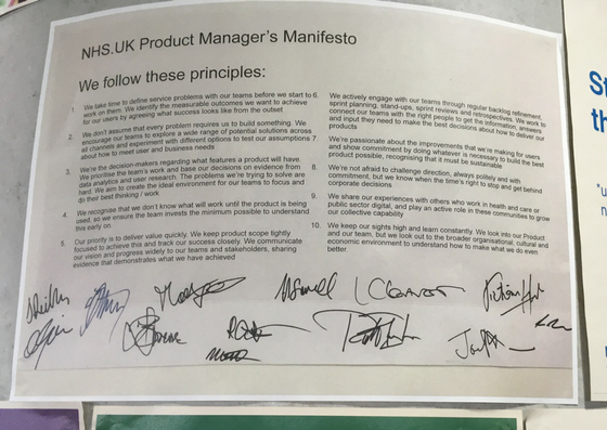 A photograph of a printed out 'manifesto' signed by all contributors in marker pen