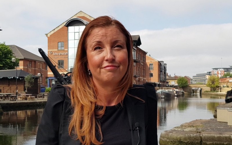 Tracey Watson head and shoulders shot standing by canal