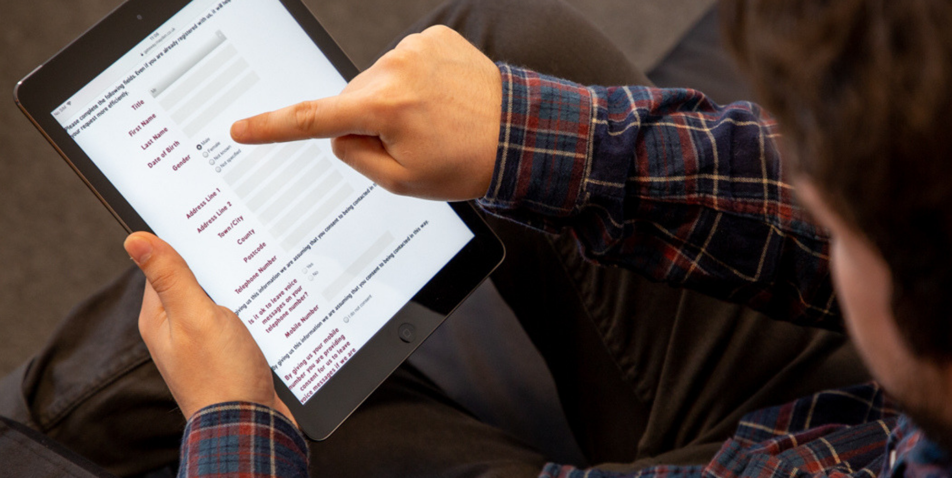 Looking at the online mental health referral form on a tablet computer